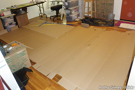 Use cardboard to protect floors when moving