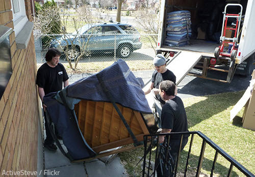 Moving a grand piano requires a lot of skill and experience.