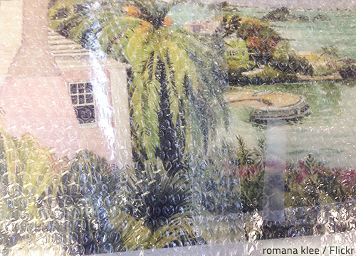 Packing pictures with bubble wrap is a good way to keep them safe during a house move.